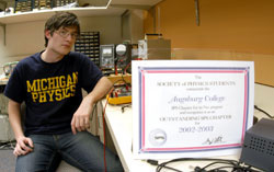 Geoffrey Shelburne, president of the SPS sitting next to certificate award.