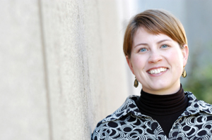 Kristen Chamberlain, picture taken outside next to concrete wall.