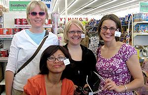 Picture of PA students getting reading glasses to give away on their trip.