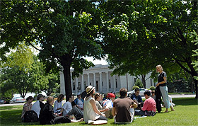 Picture of students and a teacher outside.