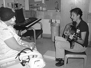 Picture of Christi Schmit working with a patient.